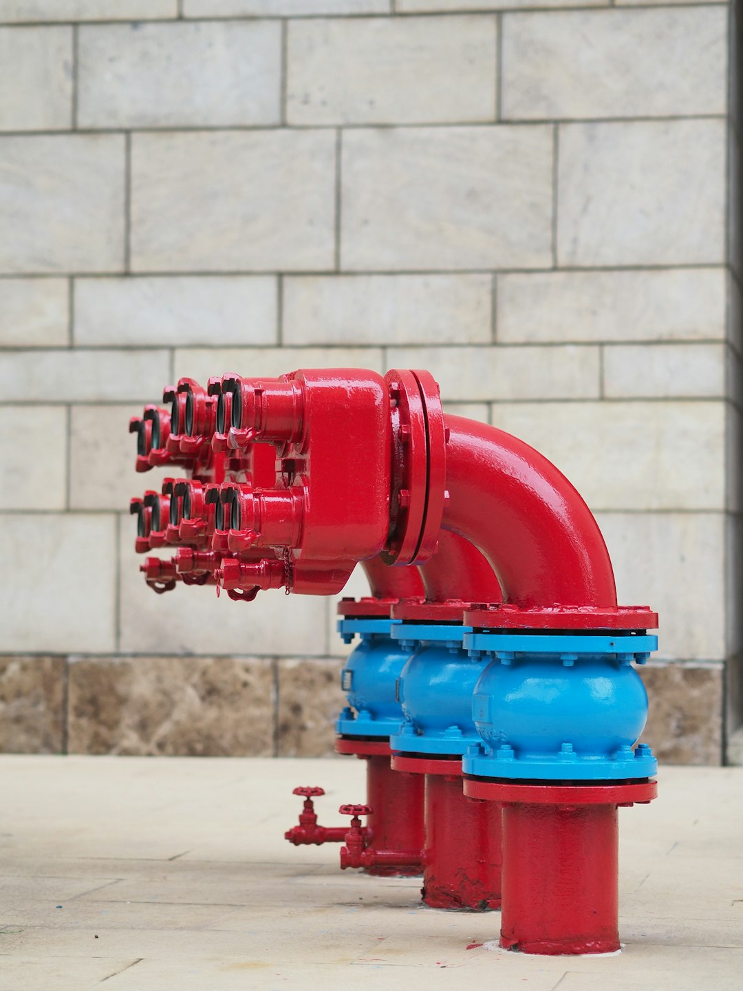 gallery-6 a-close-up-of-a-red-and-blue-fire-hydrant-bdsukqnuucs